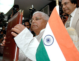 Union Minister for Railways Laloo Yadav shows the Rail Budget for 2005-06 in his office in New Delhi on Friday.