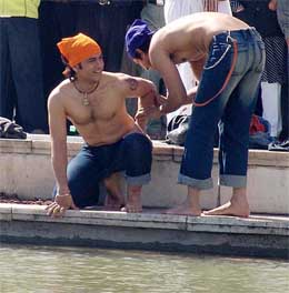 Film actor Aamir Khan shoots for his forthcoming Hindi movie Rang de Basanti at the sarovar of Golden Temple in Amritsar on Friday. 