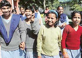 Inmates of Nari Niketan are all smiles on their return from the Rose Garden where they went for their first outing in the past six years