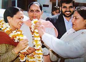 Ms Paramjit Kaur Sodhi congratulates her successor Ms Manisha Malik in Zirakpur