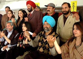 Golfers from Pakistan and their wives hold hands with Chandigarh Golf Club executive committee members during a break in the Indo-Pak Friendship Golf Tournament at the Chandigarh Golf Club on Saturday