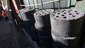 Coal blocks are stacked outside a house in Beijing