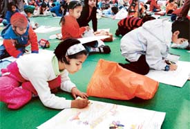 Children take part in a painting competition
