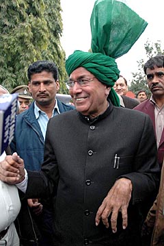 Mr Om Prakash Chautala puts up a brave face outside Raj Bhavan after submitting his resignation to the Governor in Chandigarh on Sunday.