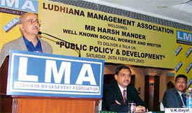 Dr Harsh Mander, a former bureaucrat, addresses a meeting on Public Policy