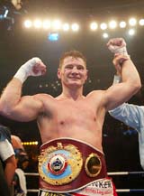 WBO light-heavyweight title holder Zsolt Erdei of Hungary raises his hands after defeating Hugo Hernan Garay of Argentina during their World Boxing Organisation