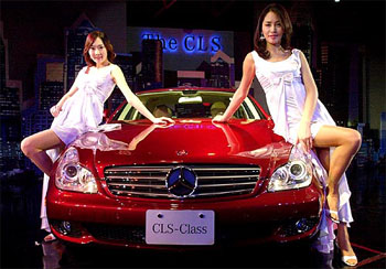 South Korean models pose with a Mercedes-Benzs CLS-Class