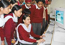 Physically challenged children get a feel of the computer at the Centre for Development of Advanced Computing on the National Science Day in Mohali on Monday.