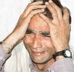 A shopkeeper mourns as his shop was reduced to ashes in a fire in the Sector 18 rehri market in Chandigarh on Monday. 