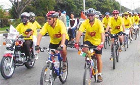A group of Australian participate in a cycle rally against female foeticide 