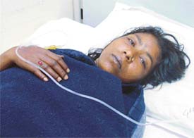The badly beaten maid servant, Rajjo, under treatment at a hospital, Ludhiana