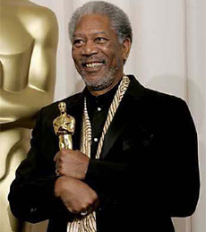 Actor Morgan Freeman poses with his Oscar statue in Hollywood on Sunday
