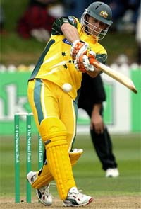 Australias Adam Gilchrist hits a boundary off New Zealand bowler Lance Hamilton during the fourth ODI