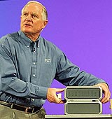 Craig Barrett, CEO of Intel Corporation, shows the 2005 version of the Entertainment PC while giving the keynote address which discussed the latest technology trends at the Intel Developer Forum in San Francisco on Tuesday. Barrett is expected to step down as the CEO in May.