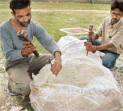 Pramod Mann and Ram Bali write poetry on stone during the first workshop which NZCC is organising in its attempt to create a permanent sculptors studio at Kalagram in Chandigarh. 