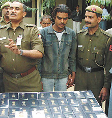 Artful forger Ashish Kumar with 122 passports at IGI airport in the Capital.
