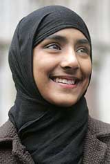 Bangladeshi Muslim schoolgirl Shabina Begum leaves the Royal Courts of Justice in London on Wednesday after winning the right to wear full Islamic dress at school.