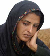 Gang-rape victim Mukhtiar Mai sits after hearing the ruling of a court in Multan, Pakistan