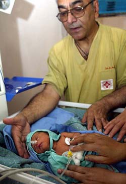 Dr Bhola Rijal presents Nepal's first test-tube baby weighing 2.25 kg