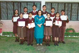 Toppers of the seventh National Science Olympiad with their teacher at Manav Mangal School, Sector 11, Panchkula on Saturday.