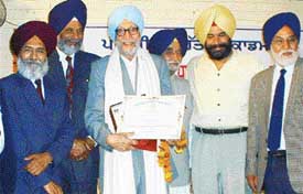 Prof Gurdial Singh receives Sarv Shreshth writers Award at Punjabi Bhavan in Ludhiana on Saturday