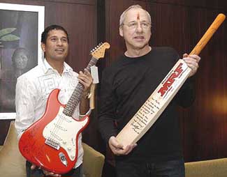 Rock guitarist\song writer Mark Knopfler and Sachin Tendulkar pose after they exchanged gifts in Mumbai