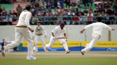 Board Presidents XI batsman Dheeraj Jadhav goes for a run on the third and final day of the match against Pakistan in Dharamsala on Saturday