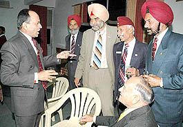 GOC-in-C, Western Command, Lieut-Gen S. Pattabhiraman interacts with retired parachute officers in Chandigarh on Saturday.