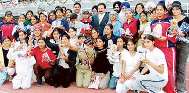 Winners of the annual athletics meet pose for a photograph with Mr Kartar Singh, Director, Punjab, at Master Tara Singh Memorial College in Ludhiana on Sunday