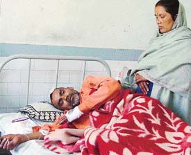 Gopal Mishra, priest, with his wife Kalpana Devi being treated at the local Civil Hospital