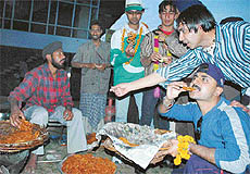 Pak visitors savour jalebis at a langar inside the Sector 16, Cricket Stadium