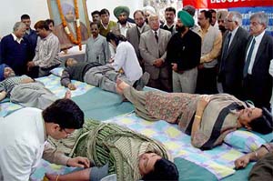 Tribune employees donate blood at a camp organised by The Tribune Employees Union at the newspaper's office in Chandigarh on Monday.  Mr R.P.Bambah, a Trustee and Mr R.N. Gupta, General Manager, are also seen. 