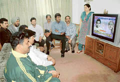 Pakistani cricket fans with a family of Phase 3B1, Mohali, watch a Hindi film on Monday.