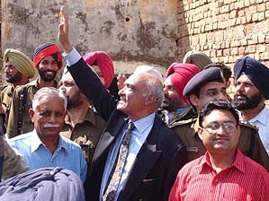 Mr Justice Halil Ramdey of the Pakistan's Supreme Court waves at residents of his ancestral village, Kariama, near Nawanshahr, on Monday.