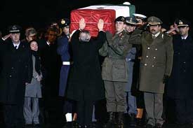 Italian president Carlo Azeglio Ciampi touches the coffin of Italian intelligence officer Nicola Calipari