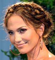 U.S. singer and actress Jennifer Lopez smiles during a photo call in Tokyo on Monday. Lopez flew into Tokyo on Sunday to promote her new film Shall We Dance? and her new album "Rebirth". 