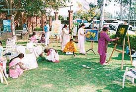 Women artists paint at Kalagram on the occasion of International Womens Day on Tuesday. 