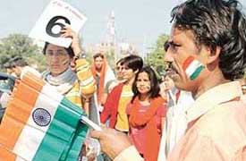 A roadside vendor sells Tricolours outside the PCA Stadium