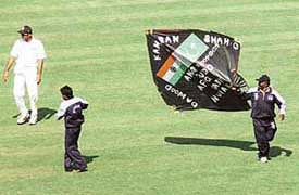A huge kite being removed by the ground staff of the PCA Stadium