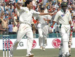Irfan Pathan exults after snaring Yousuf Youhana during the first days play of the first Test in Mohali on Tuesday. 