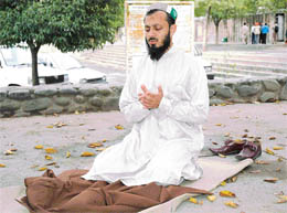 A Pakistani cricket fan offers Namaz outside Rock Garden in Chandigarh on Wednesday. 