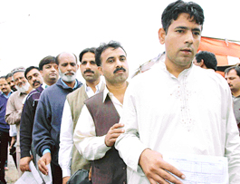 Pakistanis queue up outside the visa extension counter at the PCA stadium in Mohali.