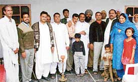 Pakistani guests with their Indian relatives during their visit to a village near Mandi Ahmedgarh