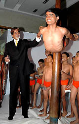 Bollywood icon Amitabh Bachchan appreciates the skill of a visually impaired gymnast at the launch of Braille Electricity Bill for the visually impaired consumers