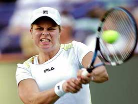 Kim Clijsters of Belgium returns a shot to Nicole Pratt of Australia 