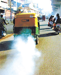 A CNG auto-rickshaw owner plying his vehicle with little worry about its road-worthiness in the Capital