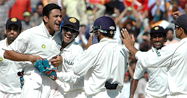 Team-mates congratulate Anil Kumble after he dismissed Pakistan captain Inzamam-ul-Haq 