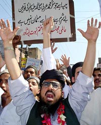Supporters of Pakistans six-party Islamic alliance Muttahida Majlis-e-Amal raise anti-government slogans during a rally in Peshawar, Pakistan, on Friday. 