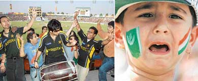 Indian and Pakistani cricket lovers dance on the last day of the Indo-Pak Test match