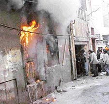 Workers trying to take out finished products from an incense sticks manufacturing factory in Fieldgunj which was severely damaged in a fire that broke out on Saturday